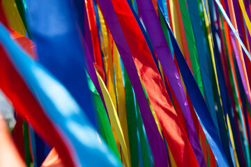Photograph of beautiful multi-colored ribbons of material fluttering in the wind. 
