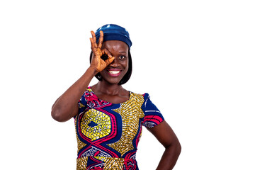 beautiful young woman making okay sign on her eye smiling.
