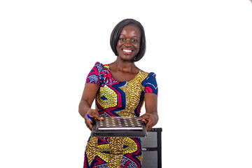 a young businesswoman in loincloth dress standing over white background looking with laptop and register smiling.