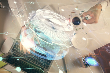 Double exposure of man's hands typing over computer keyboard and data theme hologram drawing. Top view. Technology concept.