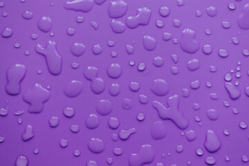 splashes of water drops on a blue background. A round drop of water. Drops, splashes, splashes, abstract figures from the water.