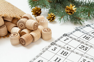 Wooden lotto barrels with bag and game cards for a game in lotto