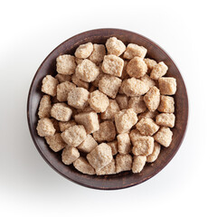 Cubes of brow cane sugar in ceramic bowl isolated on white background with clipping path