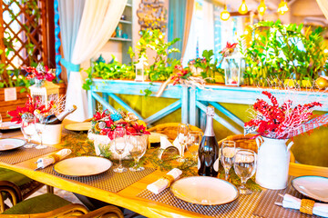 Christmas table. Festive table setting for New Year's dinner. Beautiful decoration in the restaurant awaiting guests.