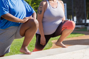 Close-up of plus size women doing sports. Chubby women of different nationalities in sport clothes...