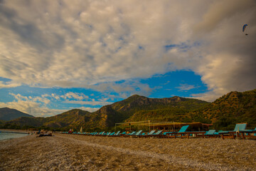 OLUDENIZ, TURKEY: Beautiful landscape with Sun Loungers on Oludeniz beach.