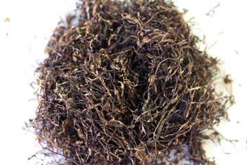 Closeup dried cut tabacco leaves on white background for defeat pests, selective focus