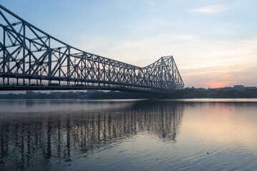 the beautiful morning view of howrah bridge, sunrise, Kolkata, India.