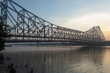the beautiful morning view of howrah bridge, sunrise, Kolkata, India.