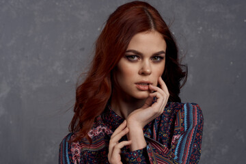 woman in coat fashionable clothes glamor red hair model