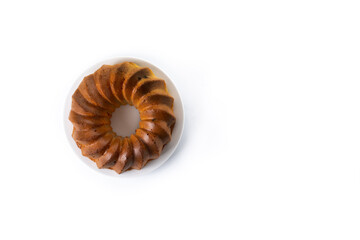 Traditional bundt cake piece with raisins isolated on white background