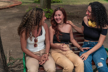 Three Latin friends having fun in the park