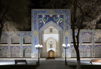 The ancient building of madrasah in Bukhara at night. Uzbekistan