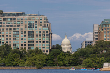 Obraz premium A Rare View of the Capitol Building Through Residential Buildings in Washington D.C.