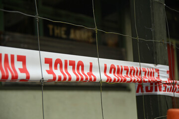police emergency tape at a crime scene - 472190897