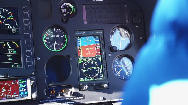 Helicopter Cockpit Mid-Flight With Blue Instrument Panel. Slow Motion.
