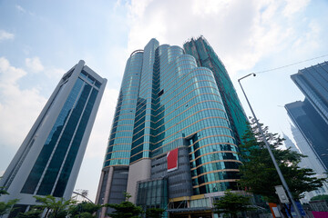 Modern city architecture. Skyscrapper against sunny sky.