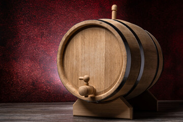 Wood barrel in pub on wooden table and dark red background