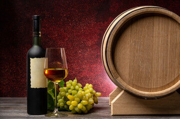 Winery background, oak barrel, wine bottle, glass ang grape