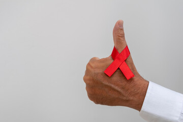 positive sign with red ribbon. AIDS prevention campaign. December red. blood donation