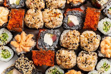 Photo of fresh maki sushi platter with a lot of variety.