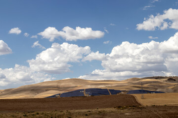 Fototapeta na wymiar landscape with blue sky, and solar farm