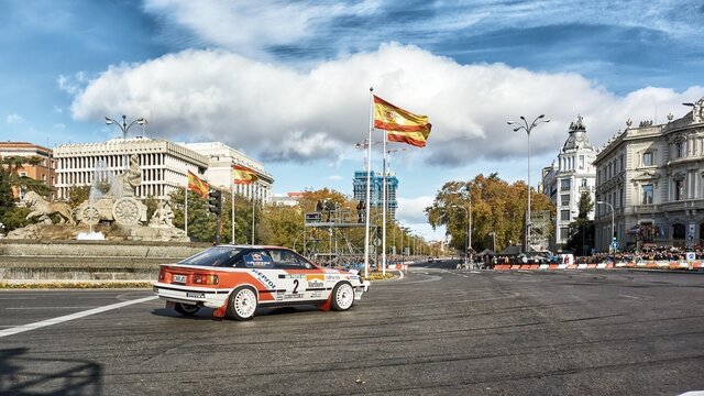 Madrid, Spain; 11-28-2021: Exhibition of the rally driver Carlos Sainz driving a Toyota Celica through the streets of Madrid passing in front of the statue of the goddess Cibeles