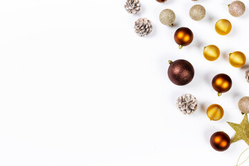 Christmas balls and pine cones on white background top view. Flat lay. Christmas and new year holiday background. Xmas greeting card concept