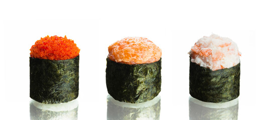 three pieces set of Japanese gunkan sushi with red tobiko caviar, minced salmon, shrimp with rice wrapped in nori seaweed. Asian food isolated on white background with reflection.
 - Powered by Adobe