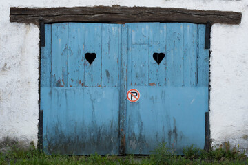 door with hearts and no-parking signal