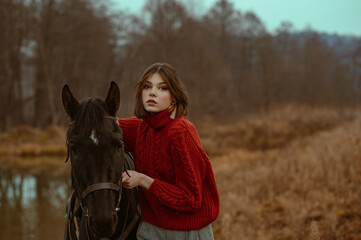 Outdoor autumn portrait of elegant fashionable woman wearing stylish knitted turtleneck sweater...