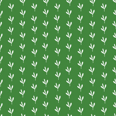 small blades of grass on a green background