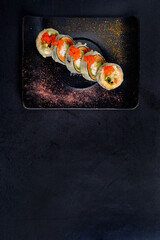 fried sushi  on the dark background