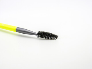 eyelash makeup brushes on white background