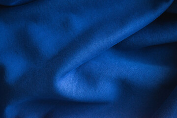 Fototapeta na wymiar Close up photo of blue textile, sweatshirt fabric.