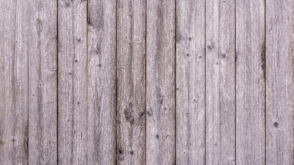 Alte verwitterte graue Holzbretter mit schöner Holzmaserung als Hintergrund