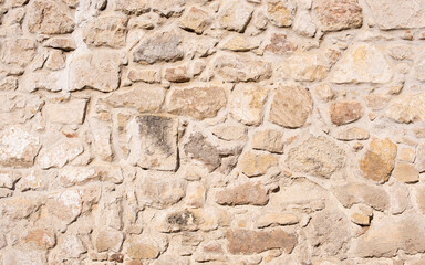 Eine alte Steinmauer mit schöner Struktur als Hintergrund