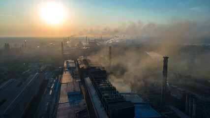 Fototapeta na wymiar metallurgical plant heavy industry poor ecology top view smoke from chimneys smog