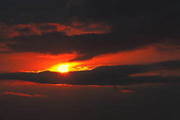 Apocalyptic red sky with dark clouds . Atmospheric mood heaven