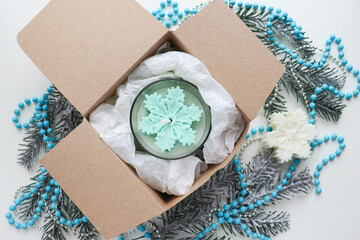 christmas gift concept. christmas time. natural soy wax christmas candle in gift box 