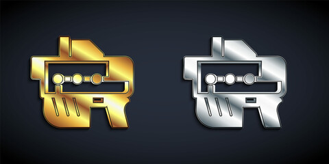 Gold and silver Futuristic space gun blaster icon isolated on black background. Laser Handgun. Alien Weapon. Long shadow style. Vector