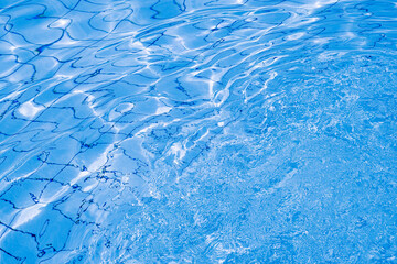 Water pool background. Blue wave pool texture, clear water surface. Abstract summer sea pattern.