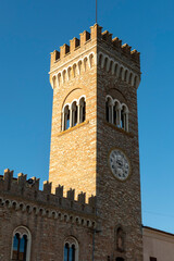 Fototapeta na wymiar the civic tower adjacent to the town hall of bertinoro with its characteristic brick walls