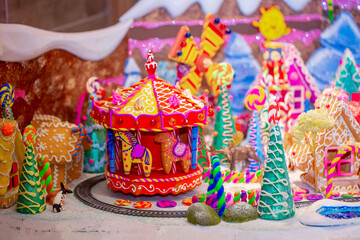 Fototapeta premium Christmas decorations in the interior. Festive background. New Year's room design, beautiful and shiny toys on the Christmas tree. Blurred background with copy space for text.