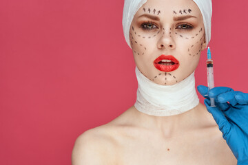 woman posing in blue gloves red lips surgery facial rejuvenation studio lifestyle