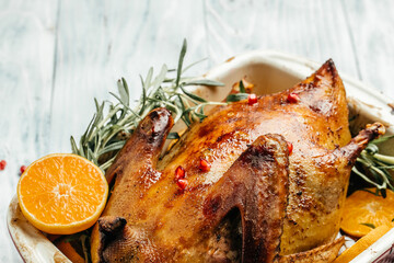 Festive Christmas duck baked with rosemary and oranges