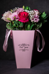 Beautiful bouquet of colorful rose flowers. Festive flowers concept.  Bouquet of fresh roses, freesias, eustoma and others.