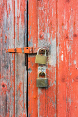 padlocks on red door