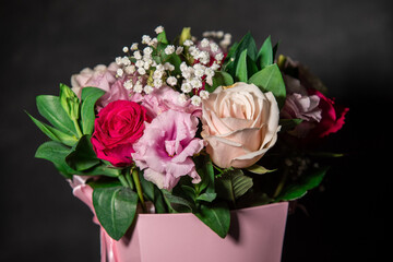 Beautiful bouquet of colorful rose flowers. Festive flowers concept. Bouquet of fresh roses, freesias, eustoma and others.