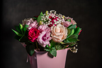 Beautiful bouquet of colorful rose flowers. Festive flowers concept. Bouquet of fresh roses, freesias, eustoma and others.